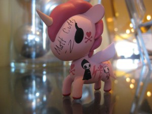 A close up of the Tokidoki Unicorno collectible art, signed by Matt Cutts